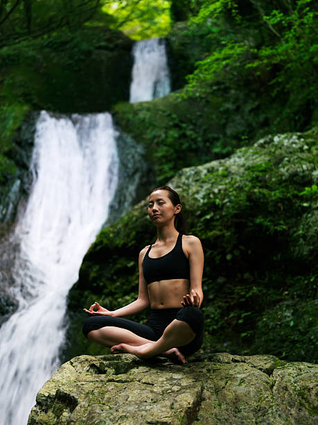 istock Woman doing yoga in nature 184376118