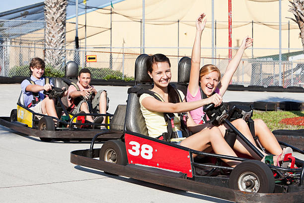 istock Teenagers riding go-carts 184376490