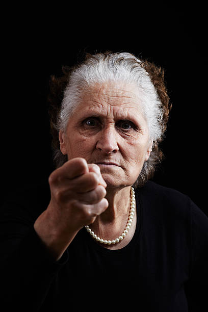 Anger "Ready for fight, Displeased old woman showing her fist" ugly old women stock pictures, royalty-free photos & images