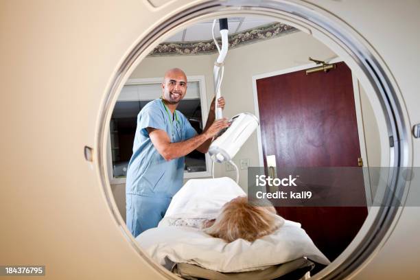 Healthcare Worker Preparing Patient For Ct Scan Stock Photo - Download Image Now - Male Nurse, Patient, Smiling