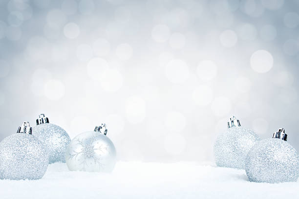 istock Silver Christmas baubles on snow with a silver background 184377296