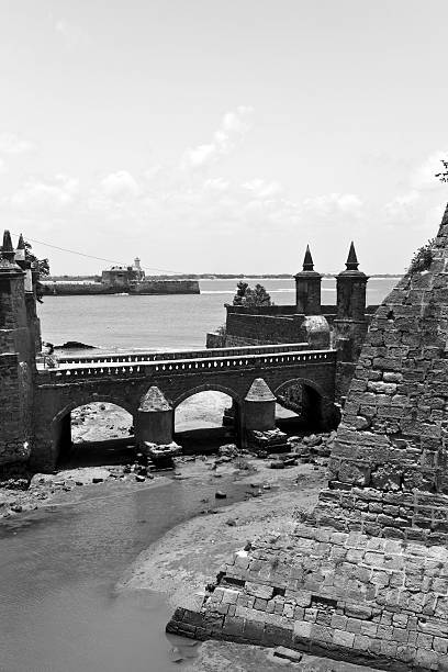 India, Diu, Fort, outer wall and bridge over moat. India, Diu, Diu Fort, outer wall and bridge over moat. diu island stock pictures, royalty-free photos & images