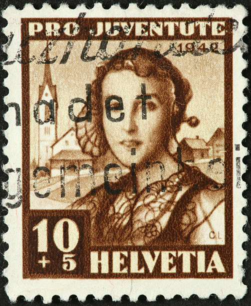 istock woman with lace on old fashioned Swiss postage stamp 184377563