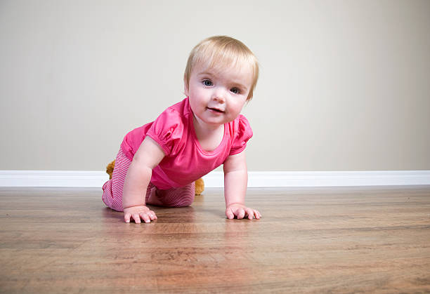 istock Baby Girl Crawling 184378193