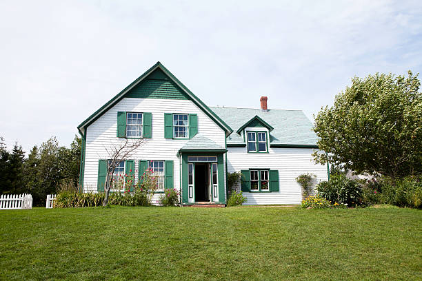 Green Gables "Green Gables, part of Lucy Maud Montgomery's Cavendish National Historic Site, has become famous around the world as the inspiration for the setting in Lucy Maud Montgomery's classic tale of fiction, Anne of Green Gables. Prince Edward Island,Canada." palisade boundary stock pictures, royalty-free photos & images