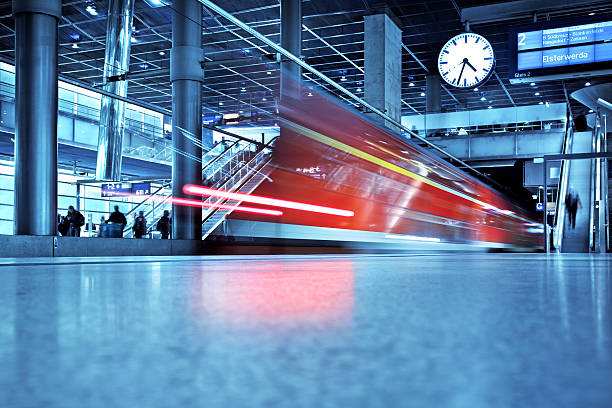 modern train station "Train leaving the Station,  motion blurmain railway-station of Berlin - Germany" subway platform stock pictures, royalty-free photos & images