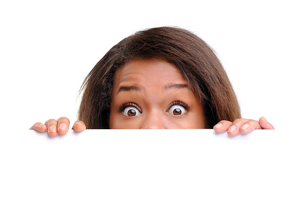 istock Businesswoman hiding behind a white empty banner 184379337
