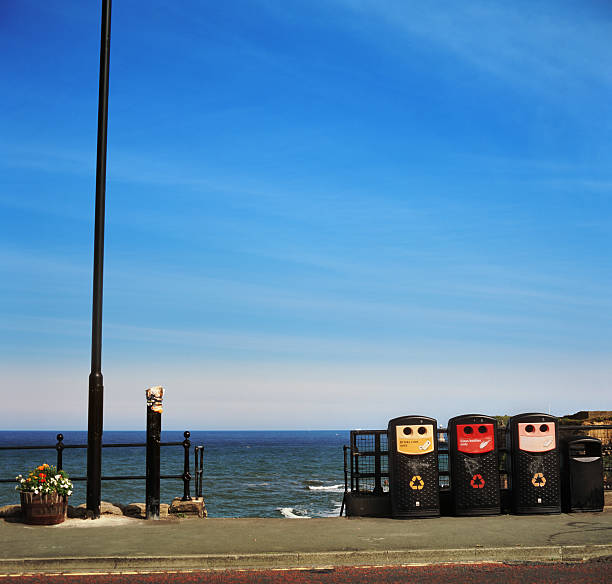 istock Recycling bins on the pavement 184379356