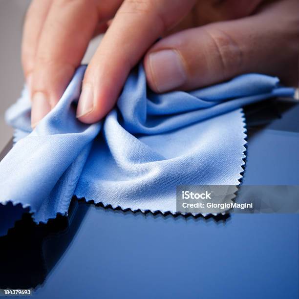 Cleaning Tablet Pc With A Cloth Stock Photo - Download Image Now - Cleaning, Mobile Phone, Clean