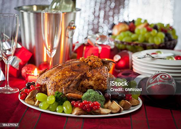 Holiday Dinner With Stuffed Turkey And Side Dishes Stock Photo - Download Image Now - Celebration, Champagne, Champagne Flute