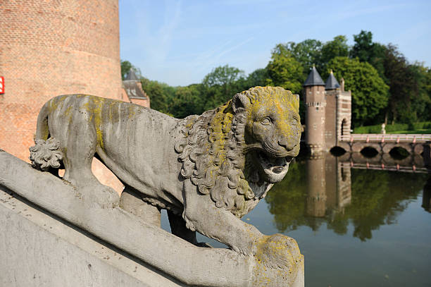 istock Stone lion in front of castle De Haar 184380239