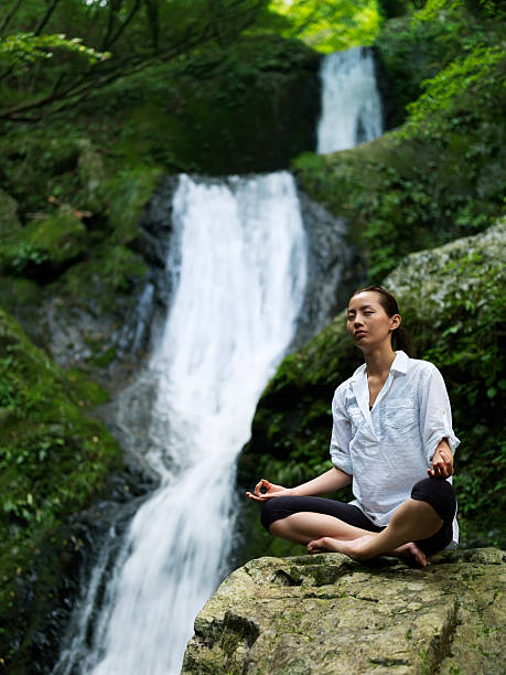 istock Woman doing yoga in nature 184380277