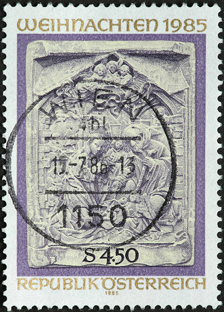 istock nativity scene sculpture on an old Austrian postage stamp 184380680