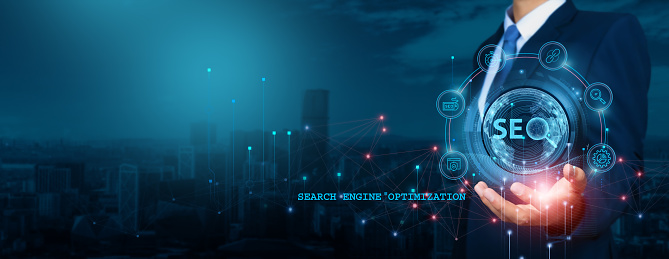 Businessman analyzing Search Engine Optimization growth trends, company visibility, devising strategies and tactics for target audience. Conducting analysis of keyword performance, website rankings.