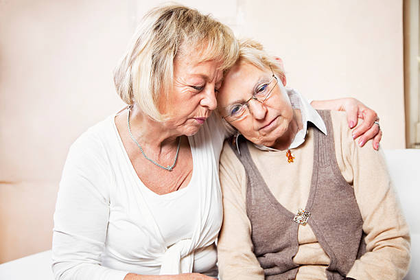 istock Senior woman comforting her sad friend 184381237