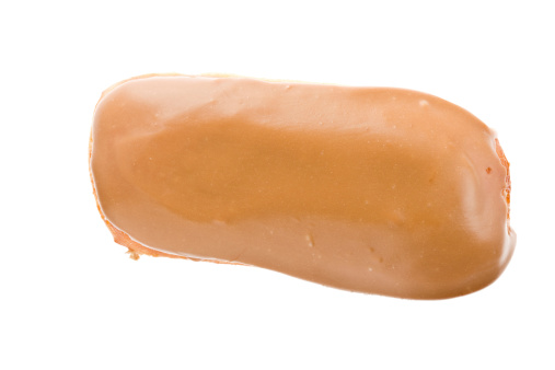 A close up of a maple bar donut. Isolated on white.