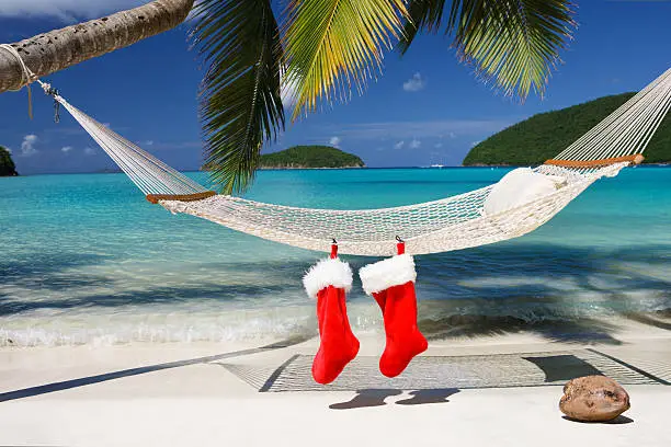 Photo of Christmas stocking on a hammock at the tropical Caribbean beach