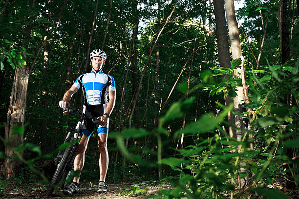 Young cyclist in nature. About 25 years old, Caucasian male.