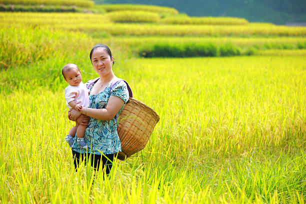 istock mother and daughter in the rice fields 184383077