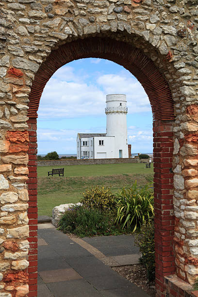 istock norfolk lighthouse viewed through ancient church doorway england 184383175