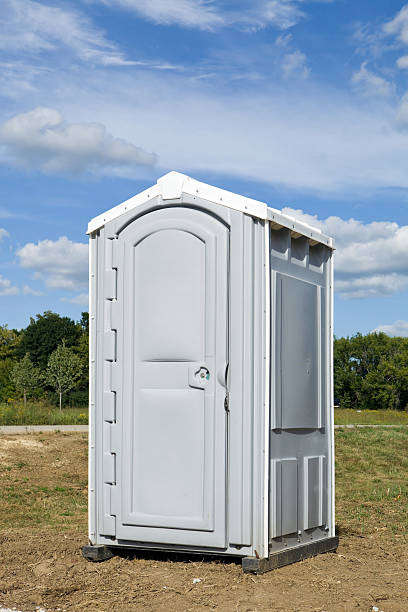 istock Portable Toilet, Outhouse, Under a Blue Sky 184383518