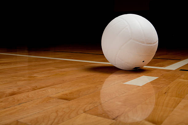 istock A white Volleyball on a hardwood floor 184383666