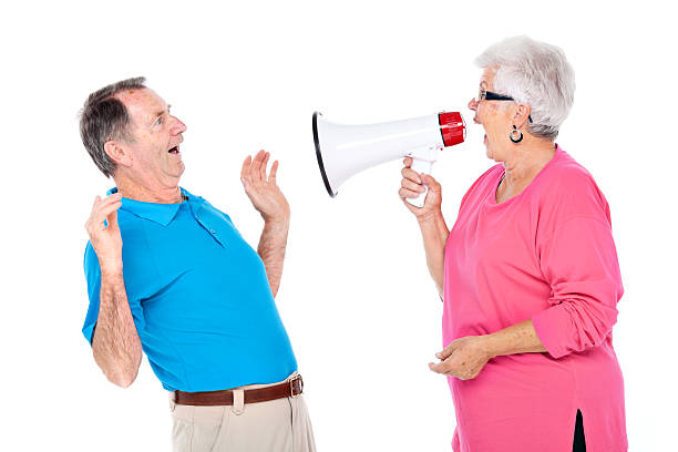 istock senior woman shouting at husband 184383681