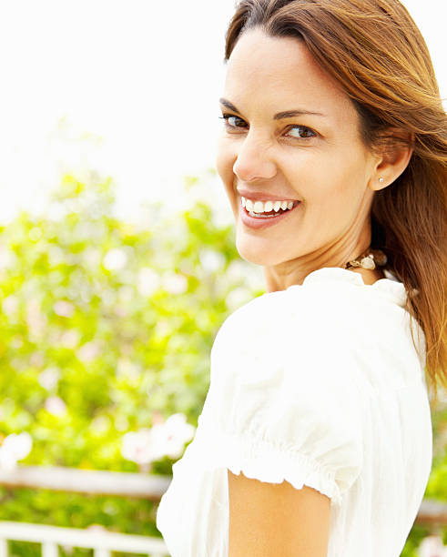 istock Woman smiling outdoors 184383740