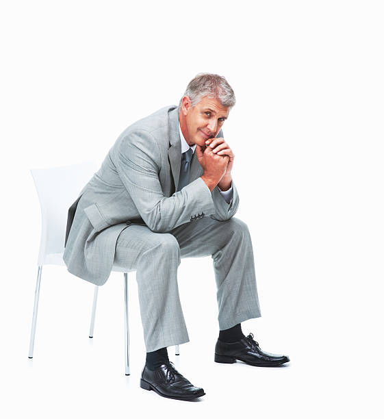 istock Smiling executive relaxing on chair 184383809