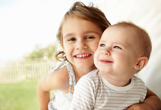 Twins hugging