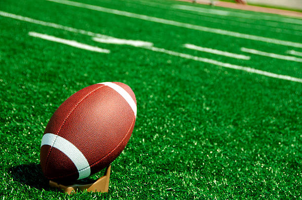 istock football ready to be kicked on a field 184384432
