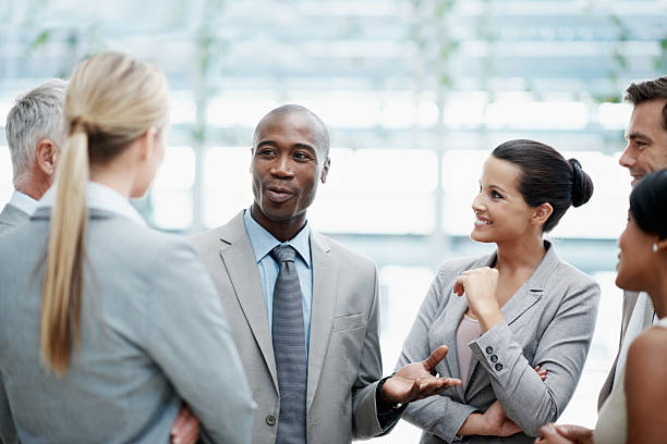 istock Business man discussing with his colleagues 184384718