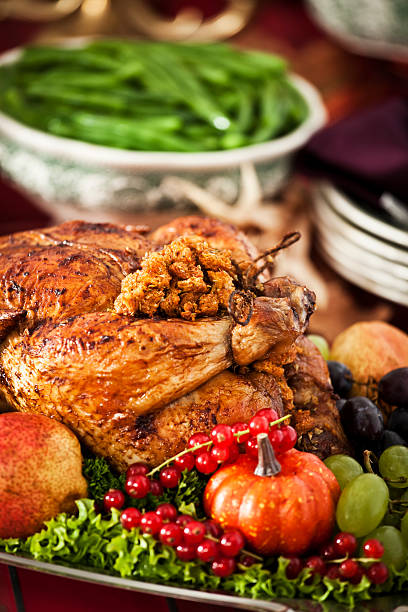 istock Thanksgiving Dinner with Stuffed Turkey and Side Dishes 184385067