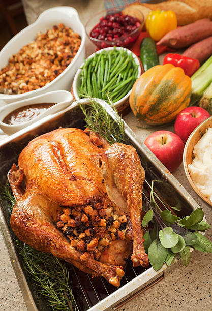 istock Thanksgiving Roast Turkey Dinner with Stuffing, Cranberries, Potato and Vegetables 184385150