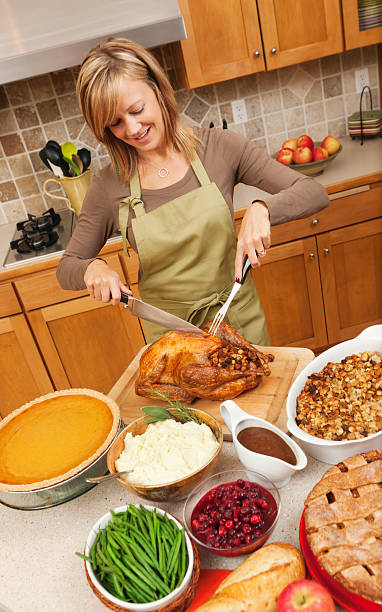 istock Preparing Cooking and Serving Thanksgiving Roast Turkey Dinner Vt 184385248