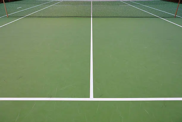 Hard court surface tennis court. Dark background.