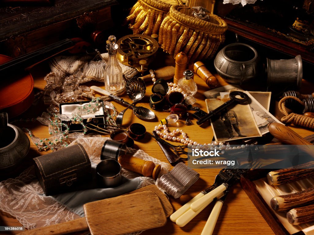 Flea Market and Collectables A mixture of antiques and collectables on a wooden table. Click on the link below to see more of my antiques and collectable images. Antique Stock Photo