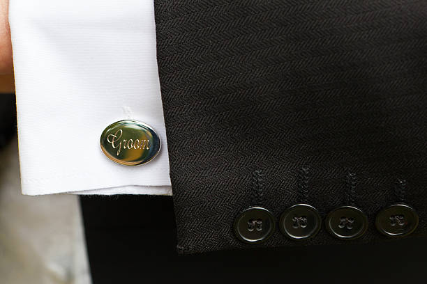 istock mans arm with groom cufflink on his wedding day 184386059