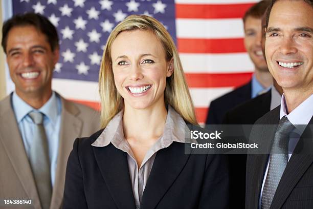 Confident Executives Smiling In Front Of Flag Stock Photo - Download Image Now - Senator, Portrait, Candidate