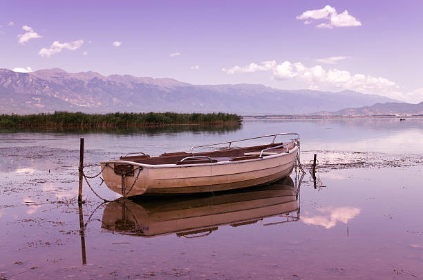istock Old Fishing boat resting on beautiful sunset 184386210