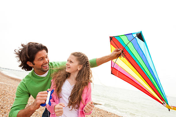 istock Father and Daughter with a Kite 184386604