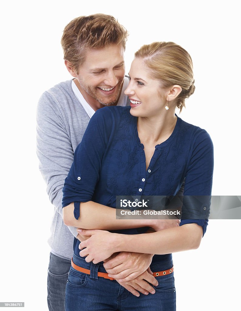 Attractive couple embracing Portrait of good looking young male embracing woman on white background 20-29 Years Stock Photo