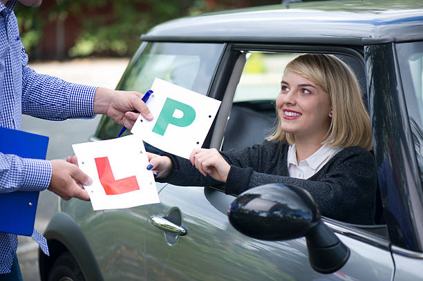 it's a pass young woman swaps her l's for p's driving test photos stock pictures, royalty-free photos & images