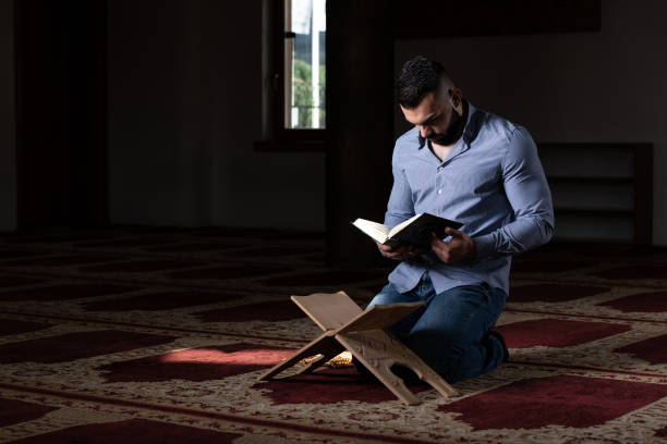 istock Muslim Man Reading Holy Islamic Book Koran 1843867890