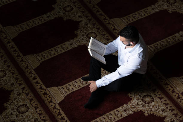 istock Muslim Man Is Reading The Koran 1843867903