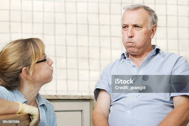 Healthcare Worker Checking Mans Swallowing Power Stock Photo - Download Image Now - Speech Therapy, Gargling, Puffed Cheeks