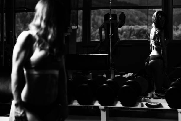 Woman In Gym Showing Her Well Trained Body stock photo