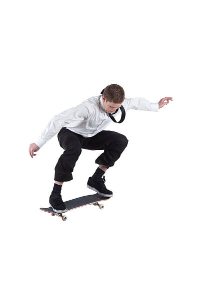istock Businessman performing stunt on a skateboard 184387628