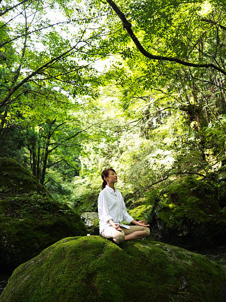istock Woman doing yoga in nature 184387833