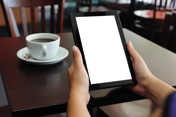 istock Hands holding Digital Tablet in a Coffee Shop 184387900